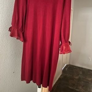 Long-sleeved dress. Length above the knee